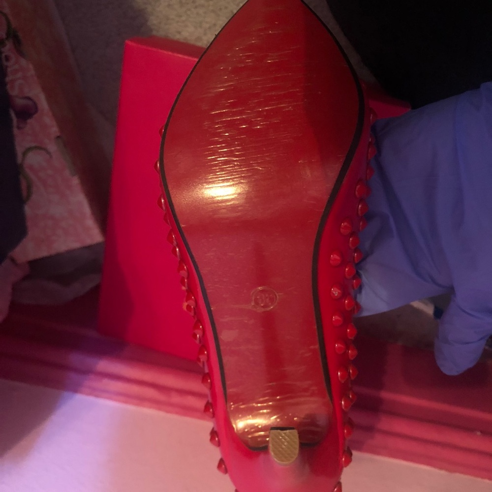 Spiked red bottom heels